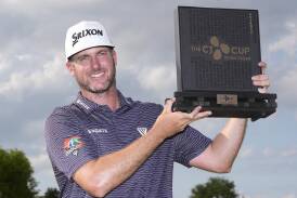 Taylor Pendrith poses with the trophy after winning the Byron Nelson golf tournament in Texas. (AP PHOTO)