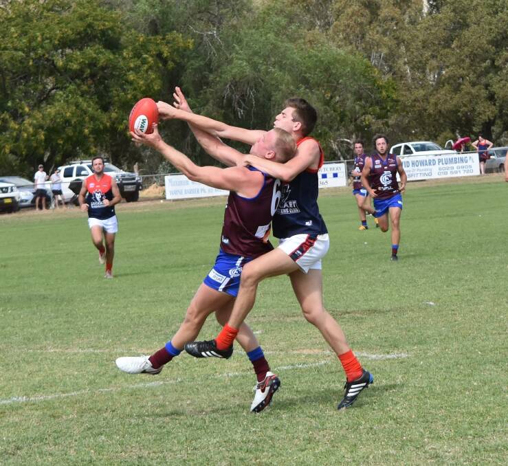 THE SPOILS: Culcairn's Trent Perczyk and Lockhart's Wylie Harrington battle for possession at the weekend. Picture: Lorri Roden