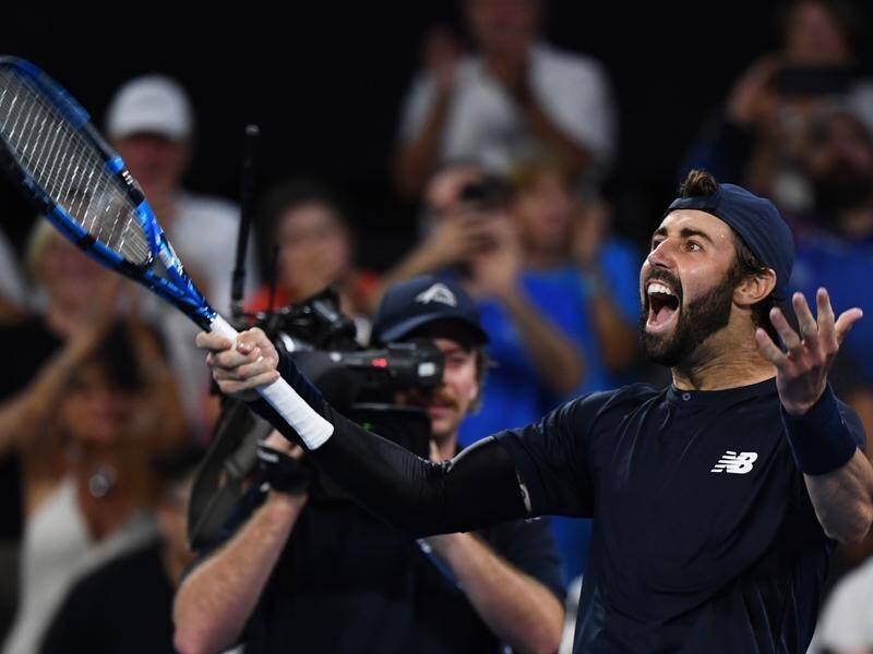 Jordan Thompson celebrates his epic triumph over Rafael Nadal in the Brisbane International. (Jono Searle/AAP PHOTOS)